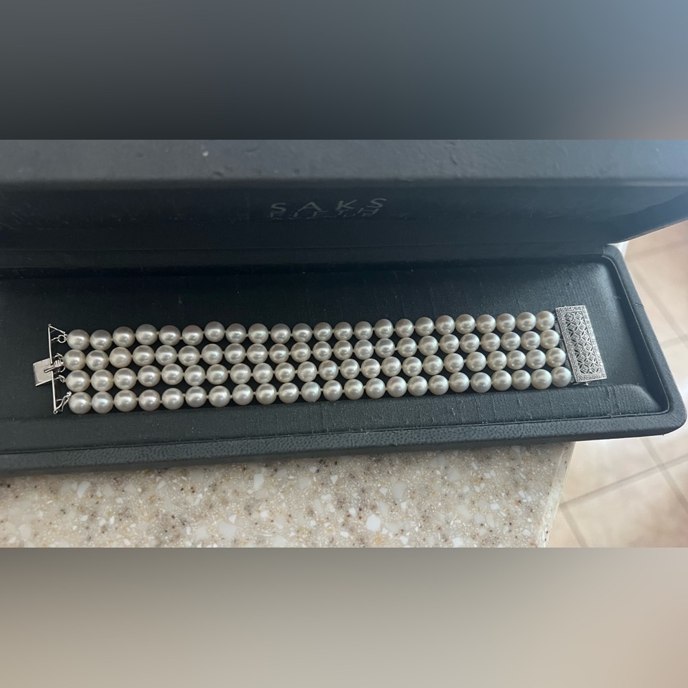 Saks Fifth Avenue Elegant white gold with diamonds clasp  Pearl bracelet